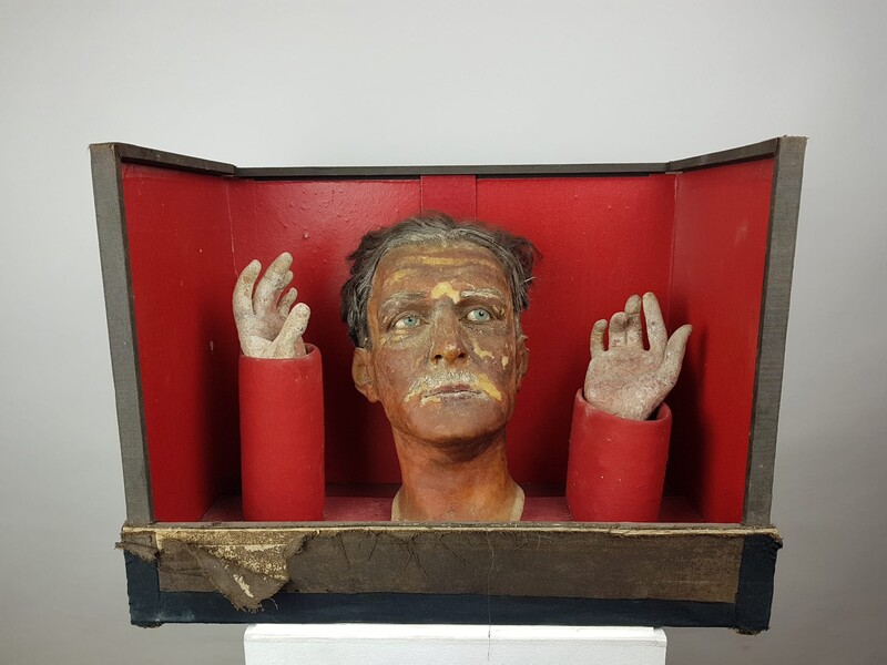 Box with head and hands in wax, papier-mâché and plaster, eyes in paperweight.