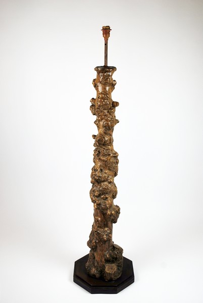 Lamppost base formed from a vine stump