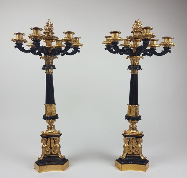 Pair of bronze candlesticks with black patina and finely chiseled gold, early 19th