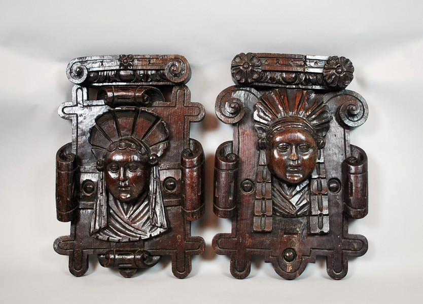 Pair of carved wooden commercial signs, late 17th C.