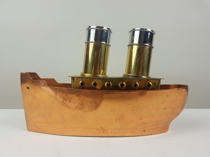 Salt and pepper display in the shape of a boat, brass and copper, circa 1940