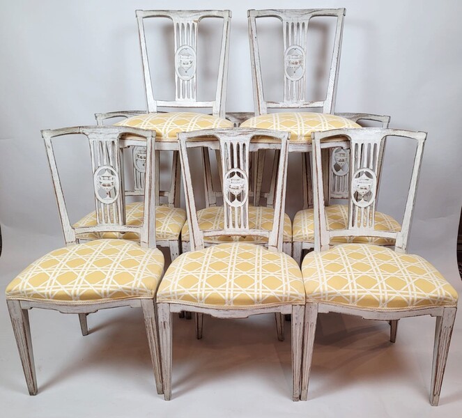 Suite of 8 patinated Directoire style chairs