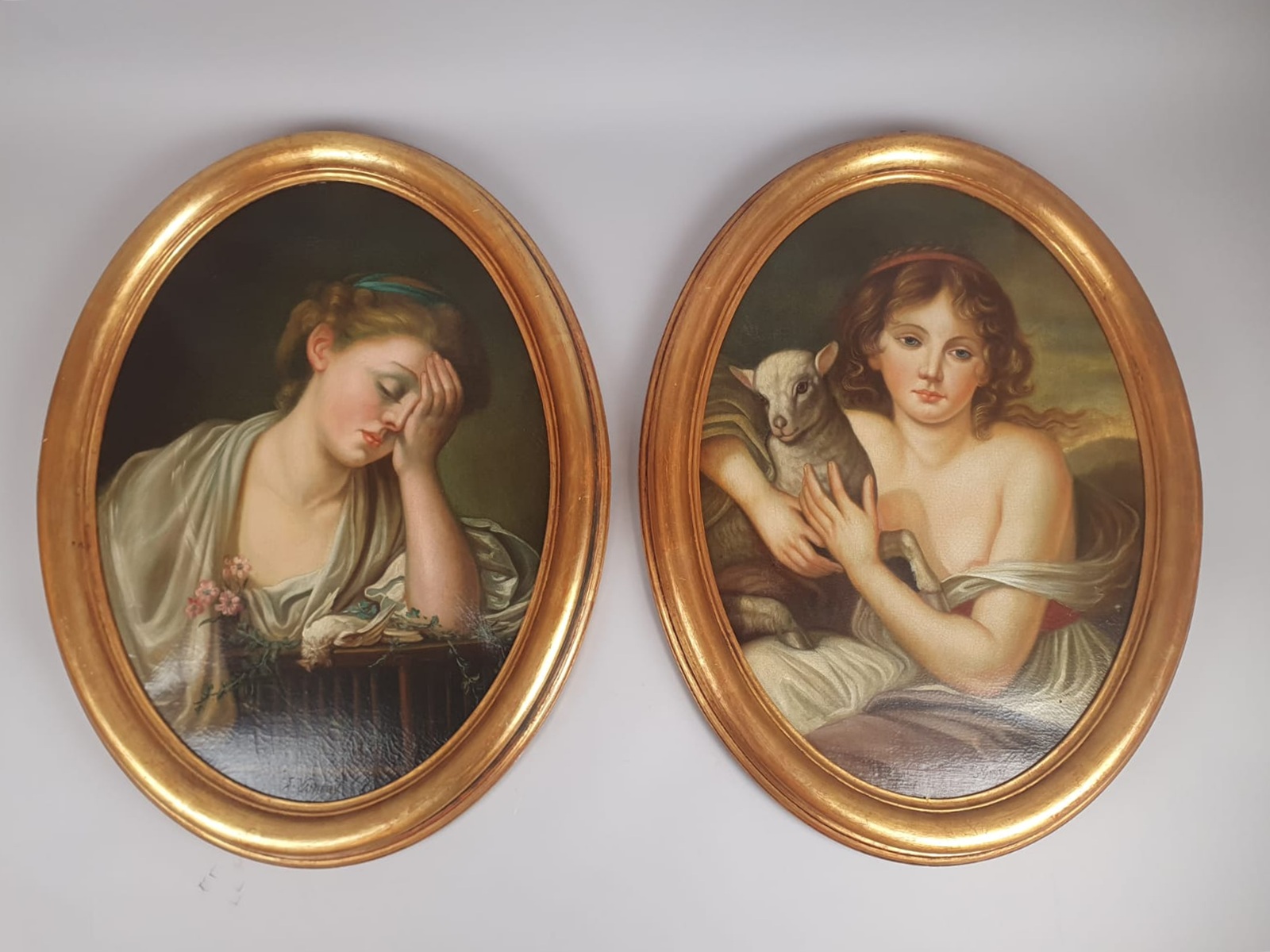 After Jean Batiste Gruze, pair of oil on canvas medallions 