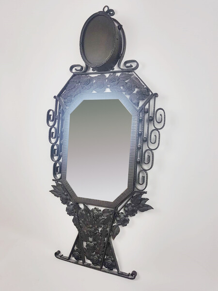 Art Deco wrought iron mirror surmounted by a lamp