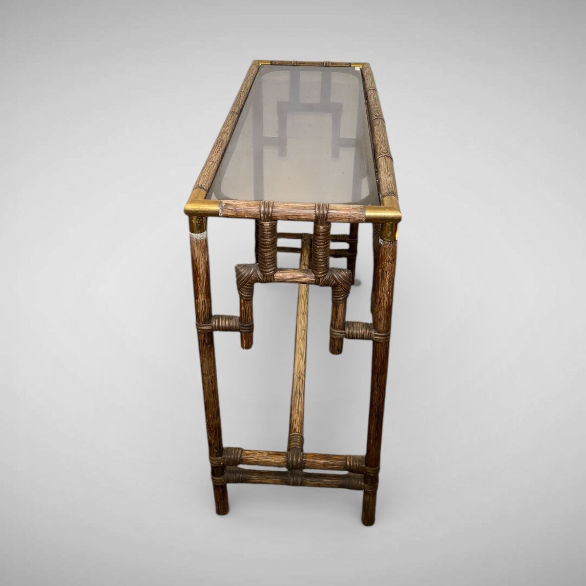 Bamboo console table with brass corners