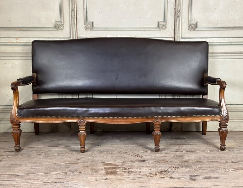 Bench in carved walnut, synthetic leather, a cigarette burn on the seat