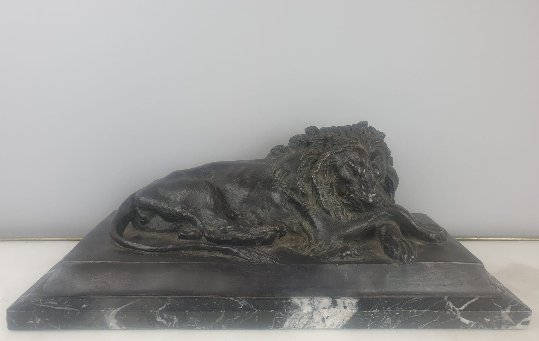 Bronze with green patina on marble base 