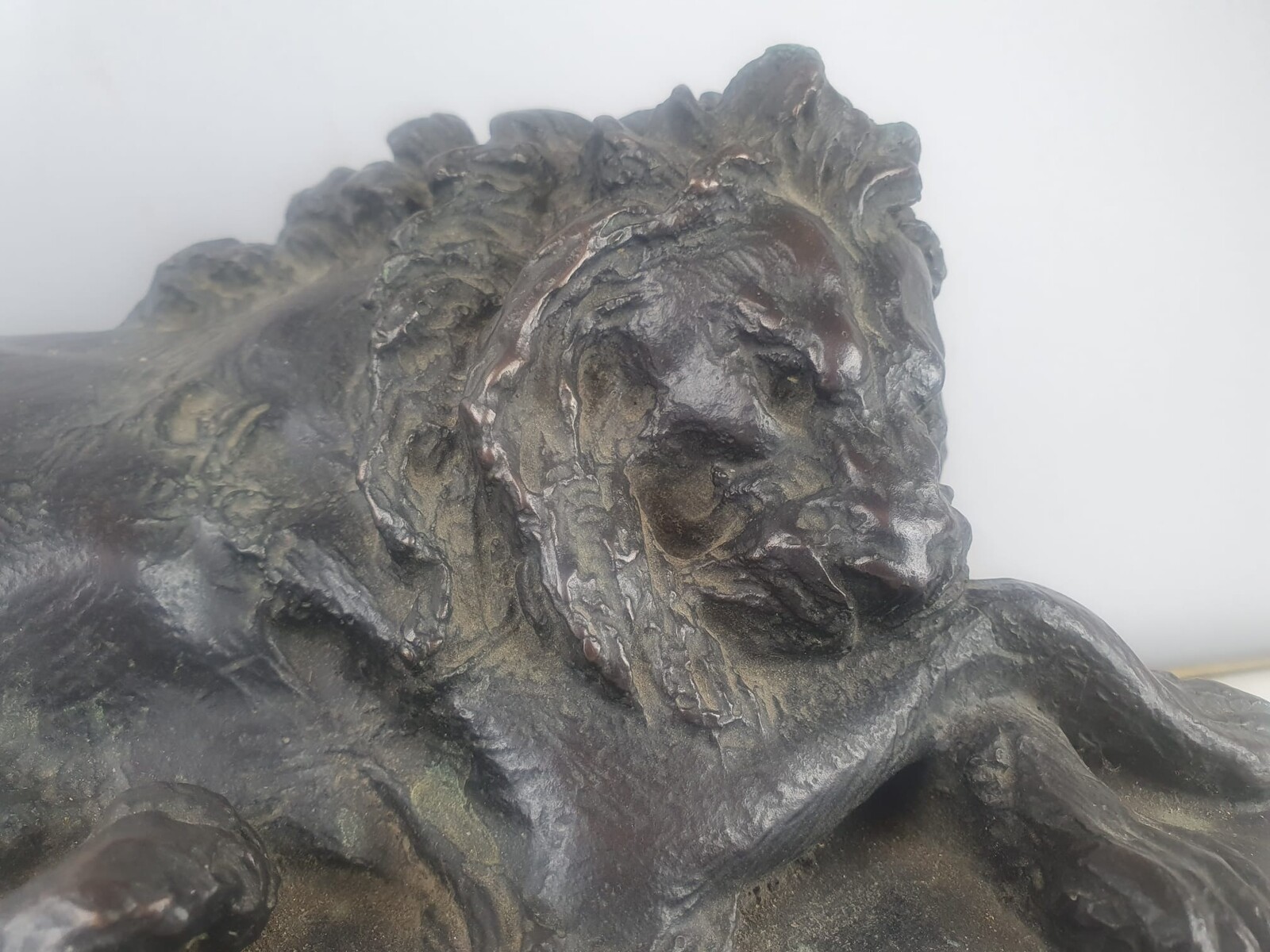 Bronze with green patina on marble base 