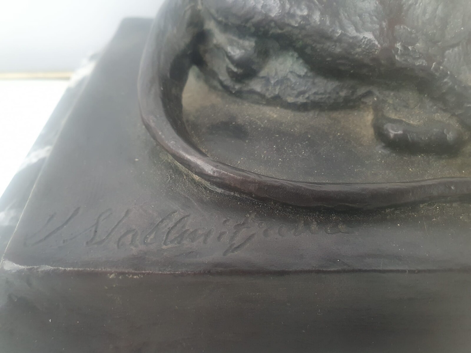 Bronze with green patina on marble base 