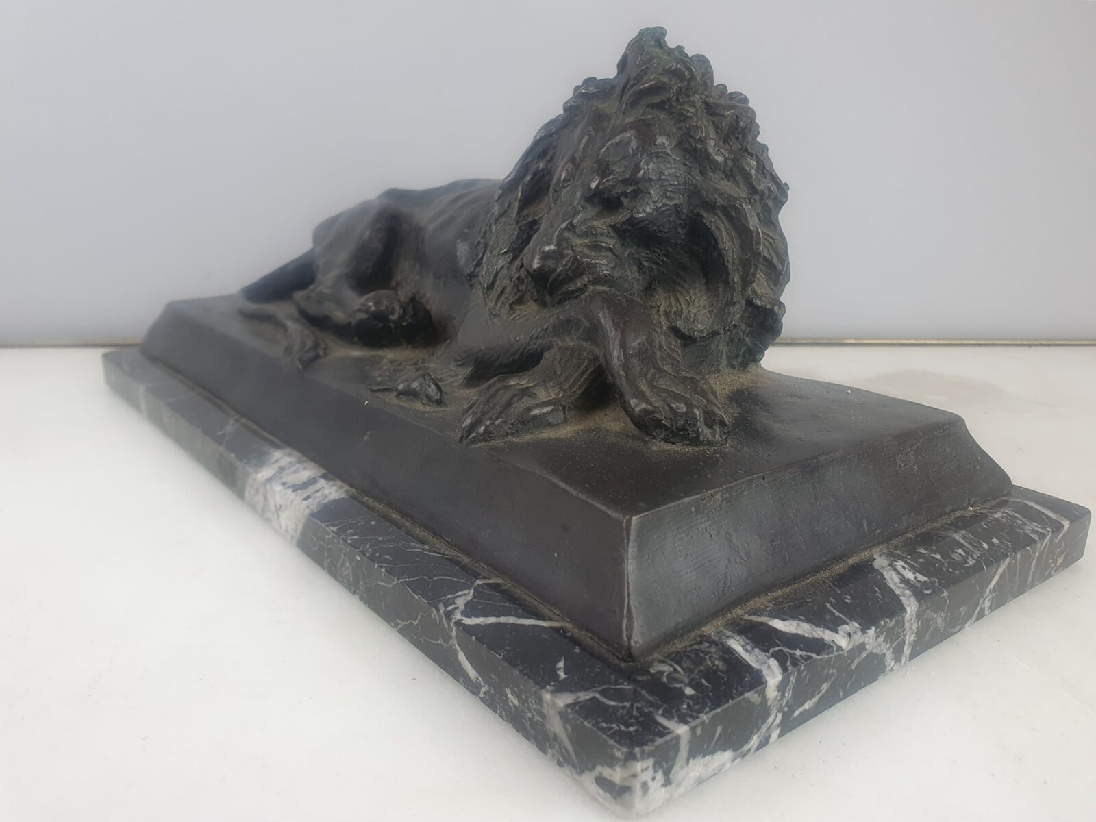 Bronze with green patina on marble base 