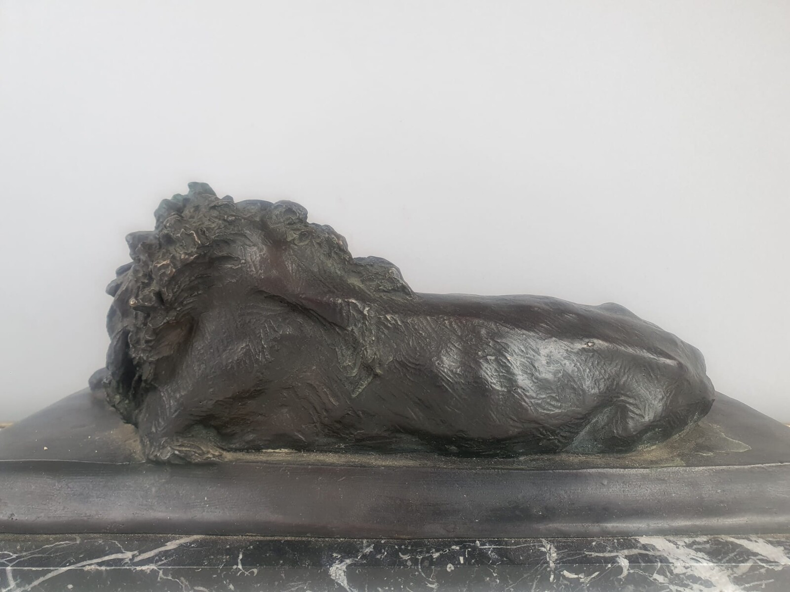 Bronze with green patina on marble base 