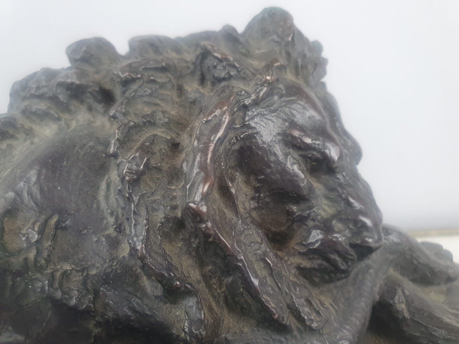 Bronze with green patina on marble base 
