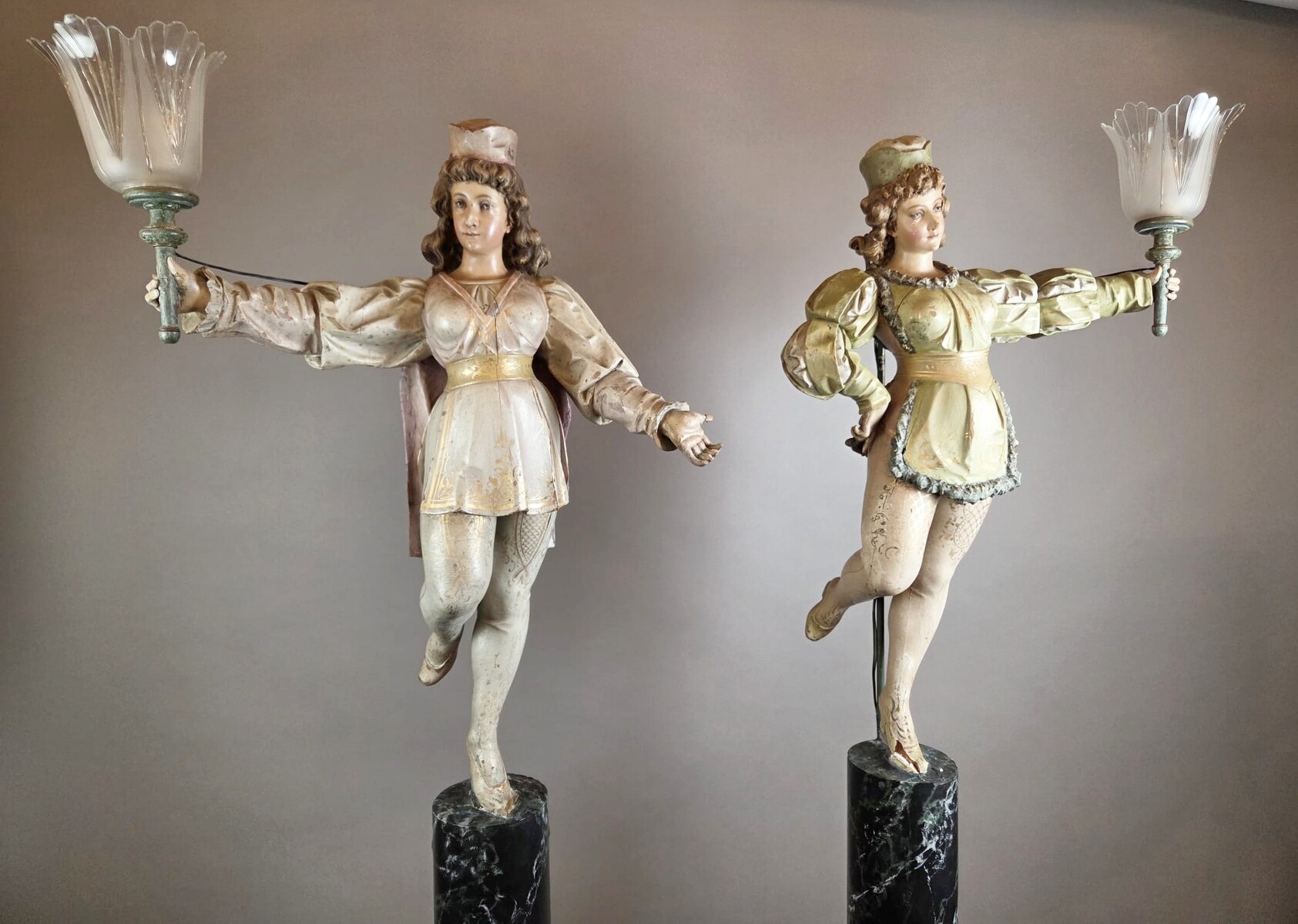 Carved and polychromed wood torchères on cast-iron columns, late 19th century