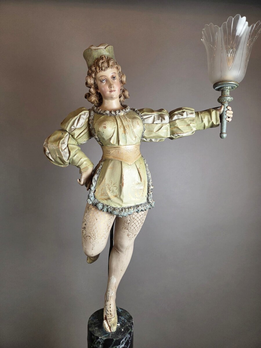 Carved and polychromed wood torchères on cast-iron columns, late 19th century