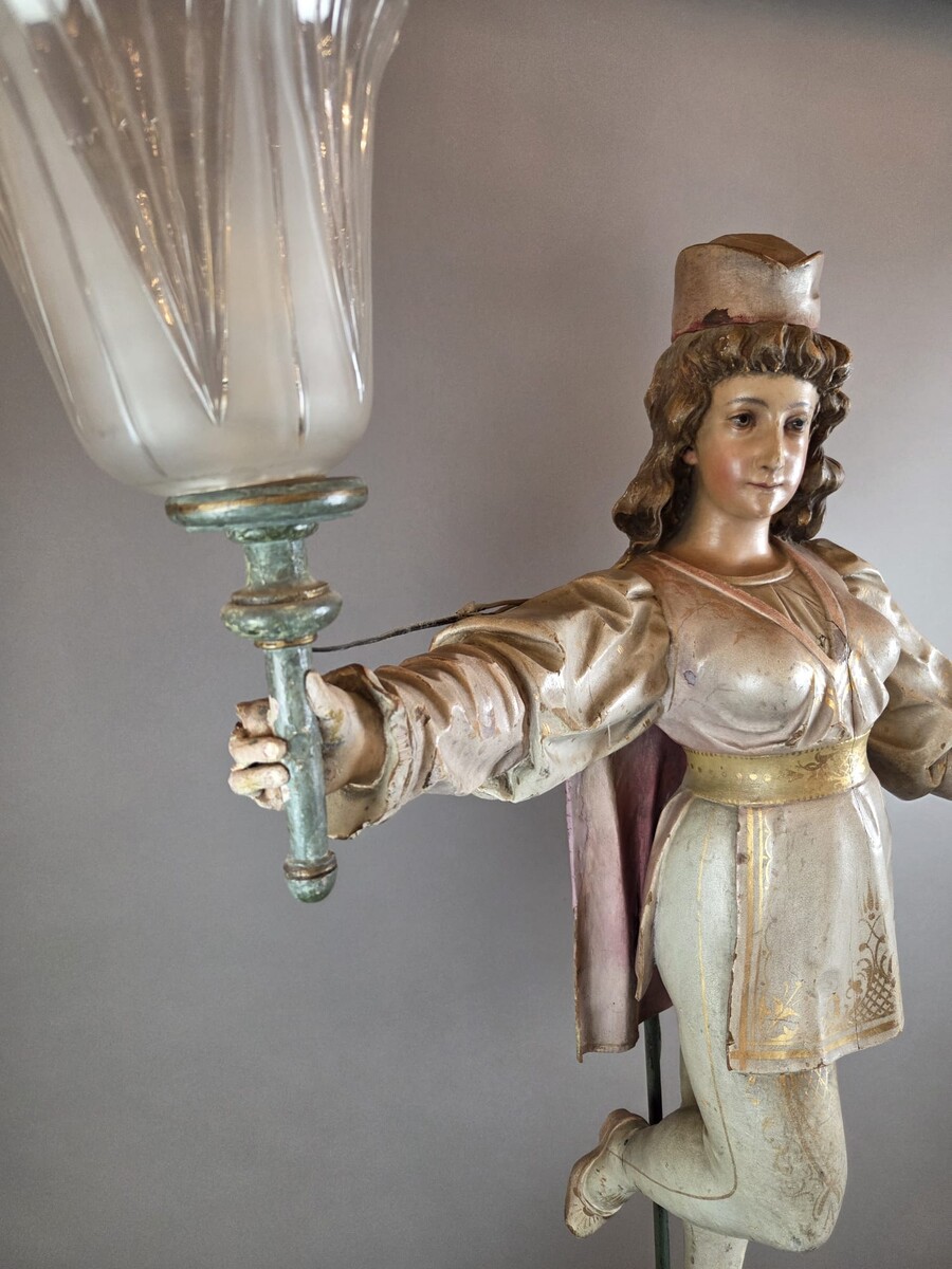 Carved and polychromed wood torchères on cast-iron columns, late 19th century