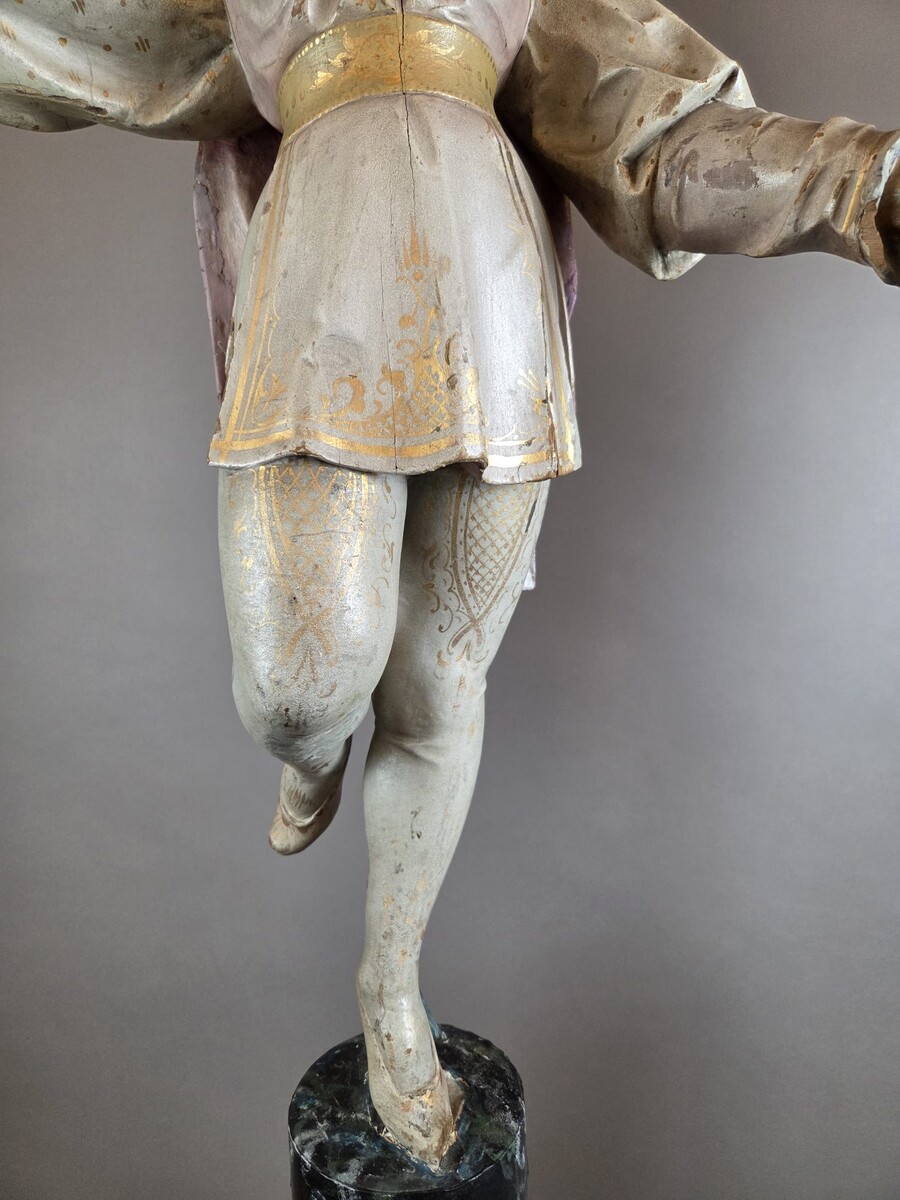 Carved and polychromed wood torchères on cast-iron columns, late 19th century