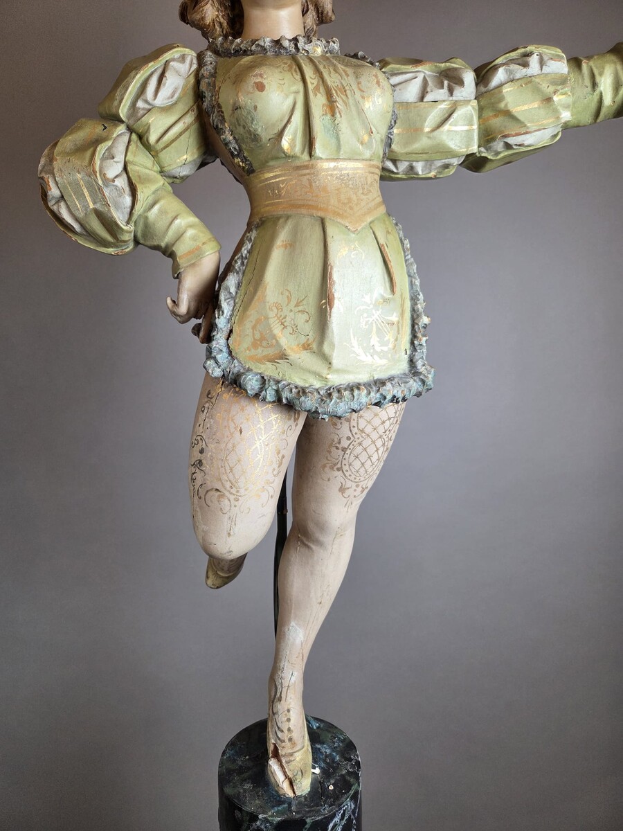 Carved and polychromed wood torchères on cast-iron columns, late 19th century