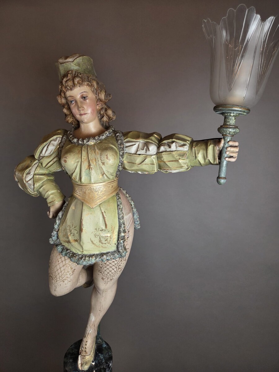 Carved and polychromed wood torchères on cast-iron columns, late 19th century