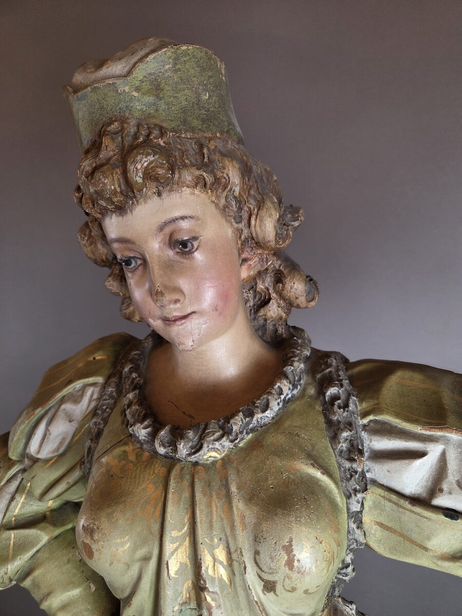 Carved and polychromed wood torchères on cast-iron columns, late 19th century