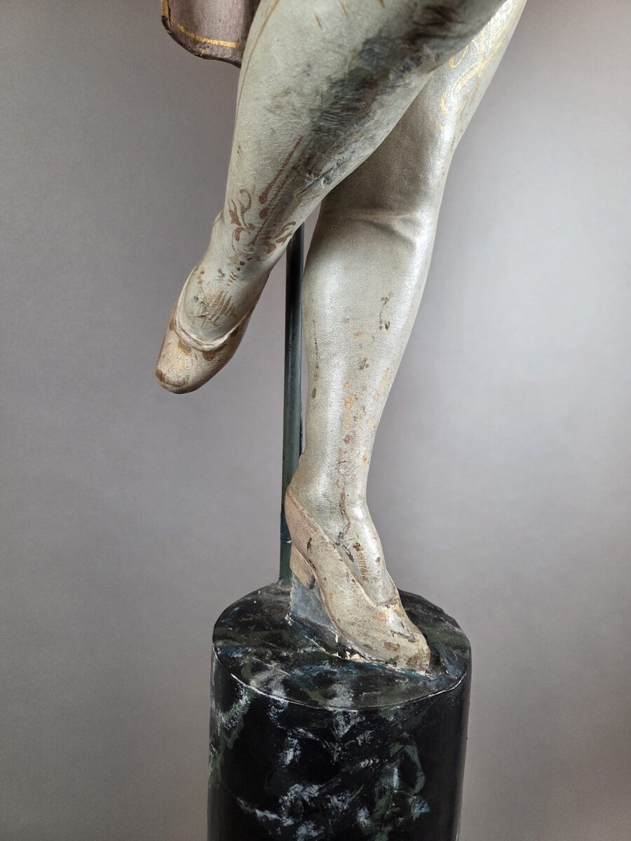 Carved and polychromed wood torchères on cast-iron columns, late 19th century