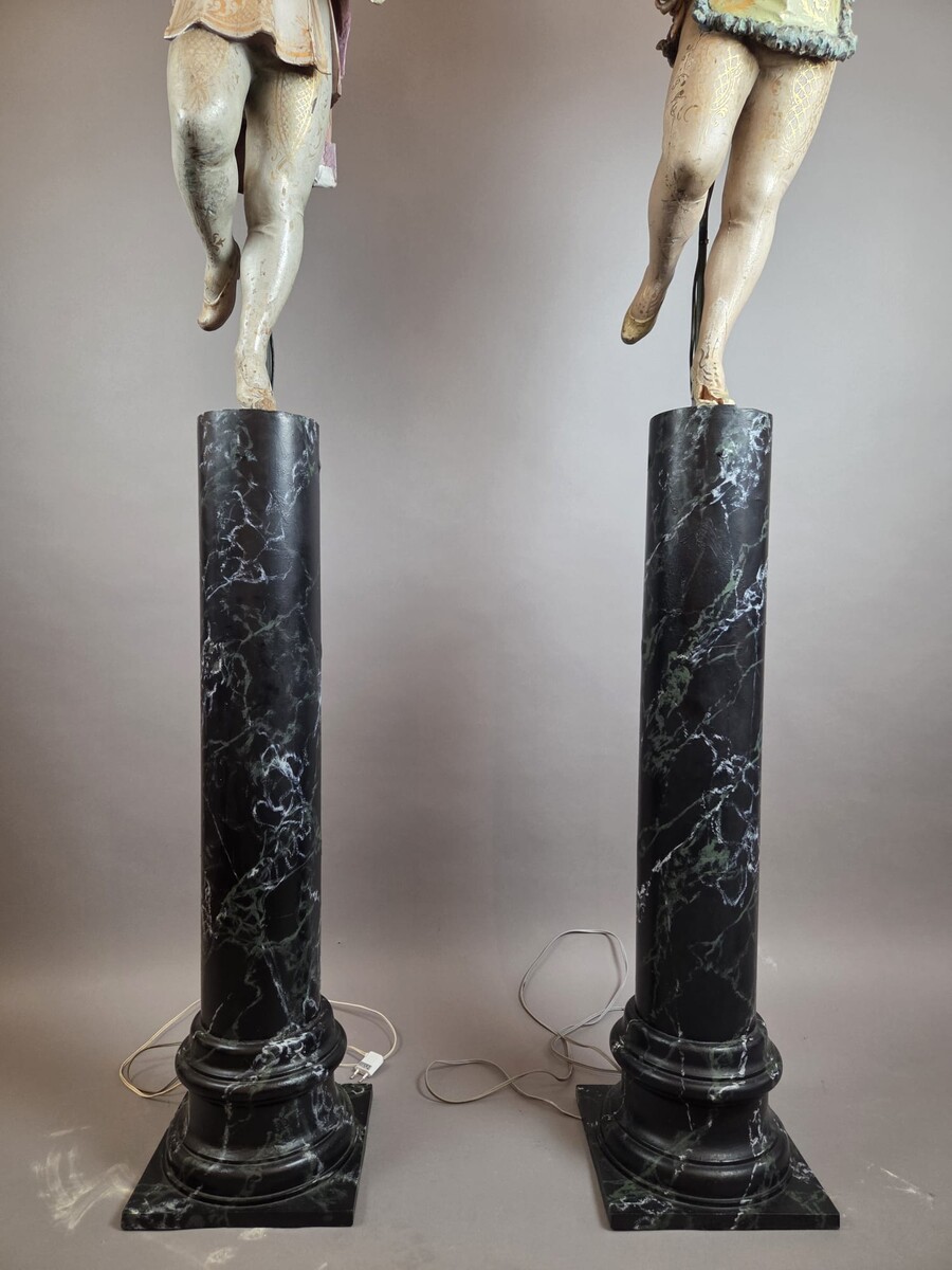 Carved and polychromed wood torchères on cast-iron columns, late 19th century