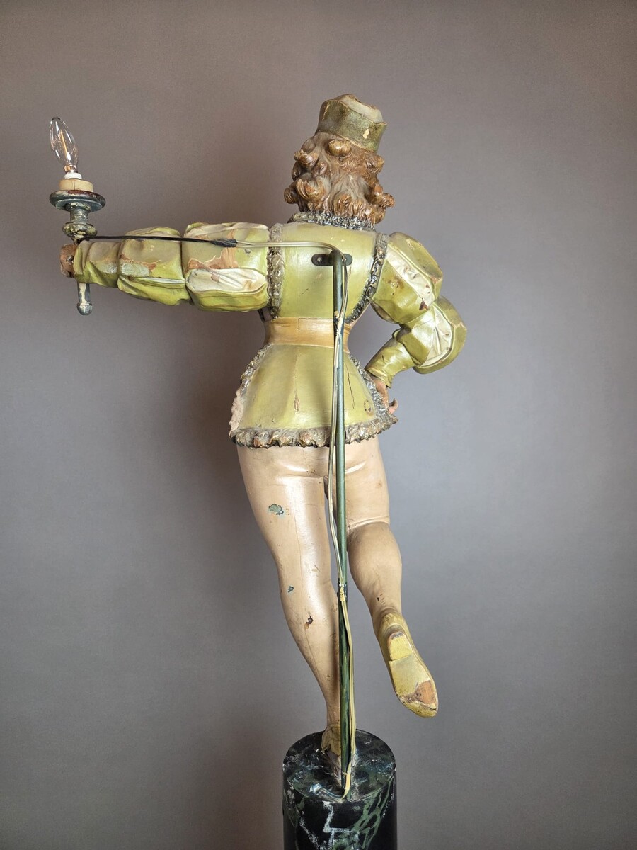 Carved and polychromed wood torchères on cast-iron columns, late 19th century