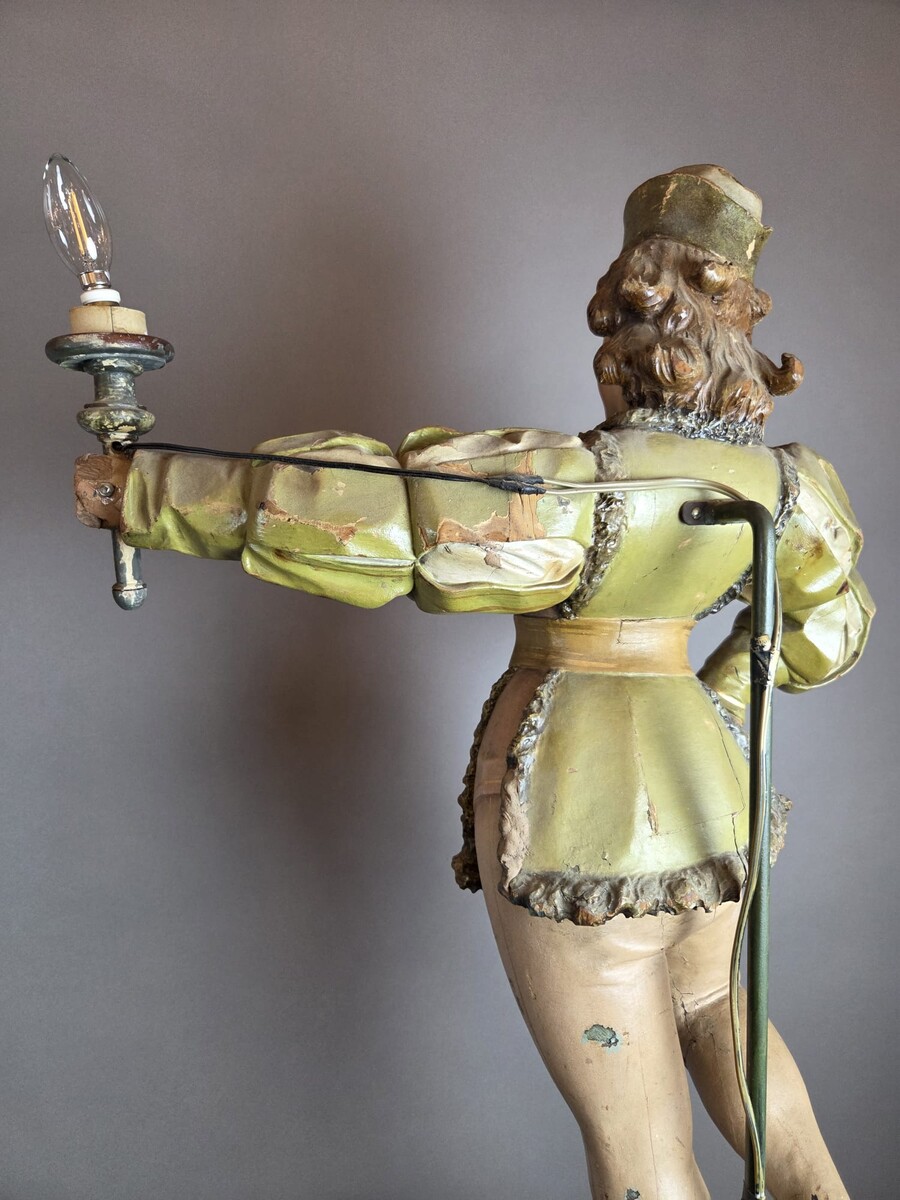 Carved and polychromed wood torchères on cast-iron columns, late 19th century