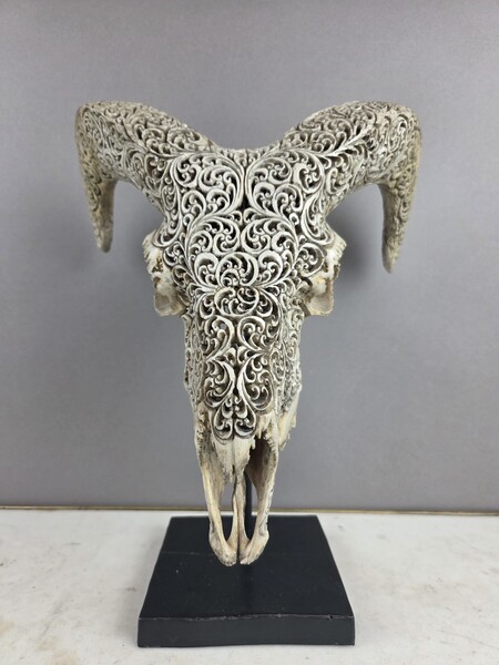 Carved bone ram skull