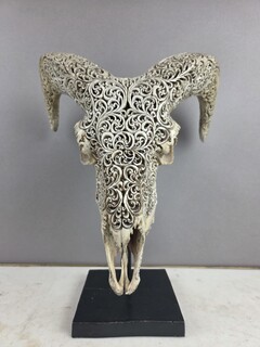 Carved bone ram skull