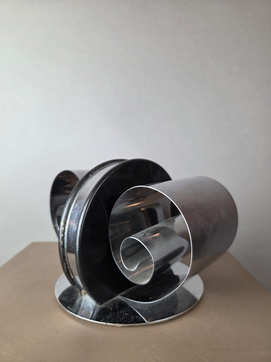 chrome-plated metal and lacquered wood bookend, circa 1935