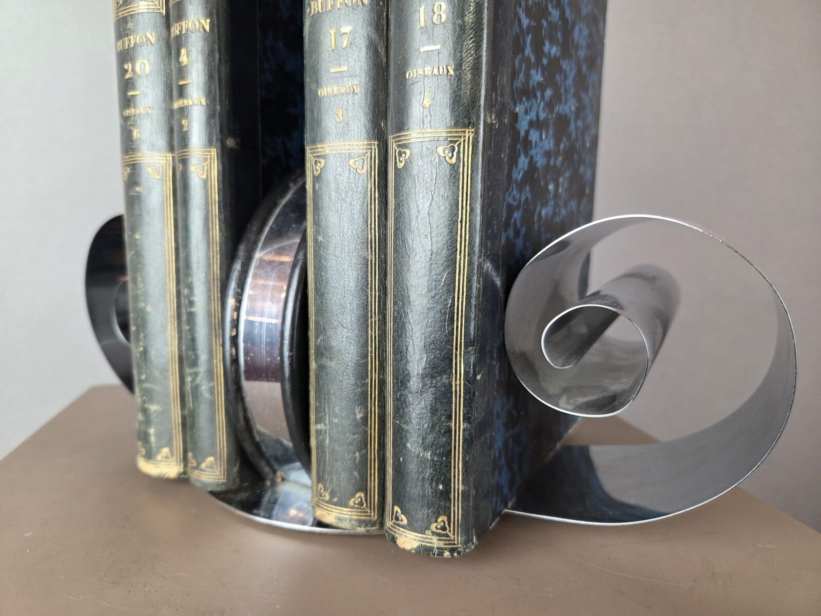 chrome-plated metal and lacquered wood bookend, circa 1935