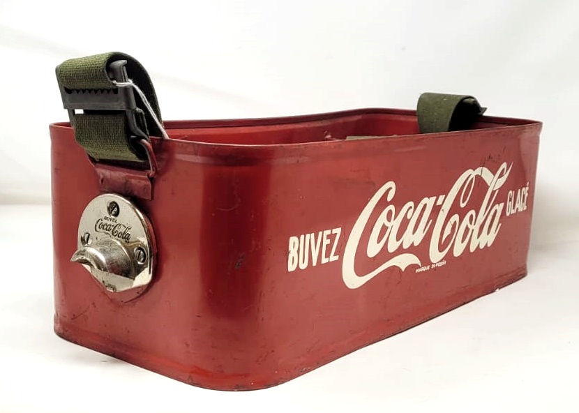Coca Cola display with shoulder strap, painted sheet metal circa 1960