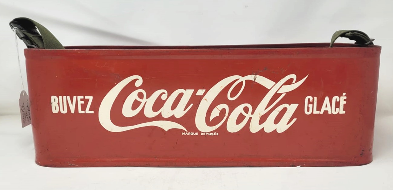 Coca Cola display with shoulder strap, painted sheet metal circa 1960