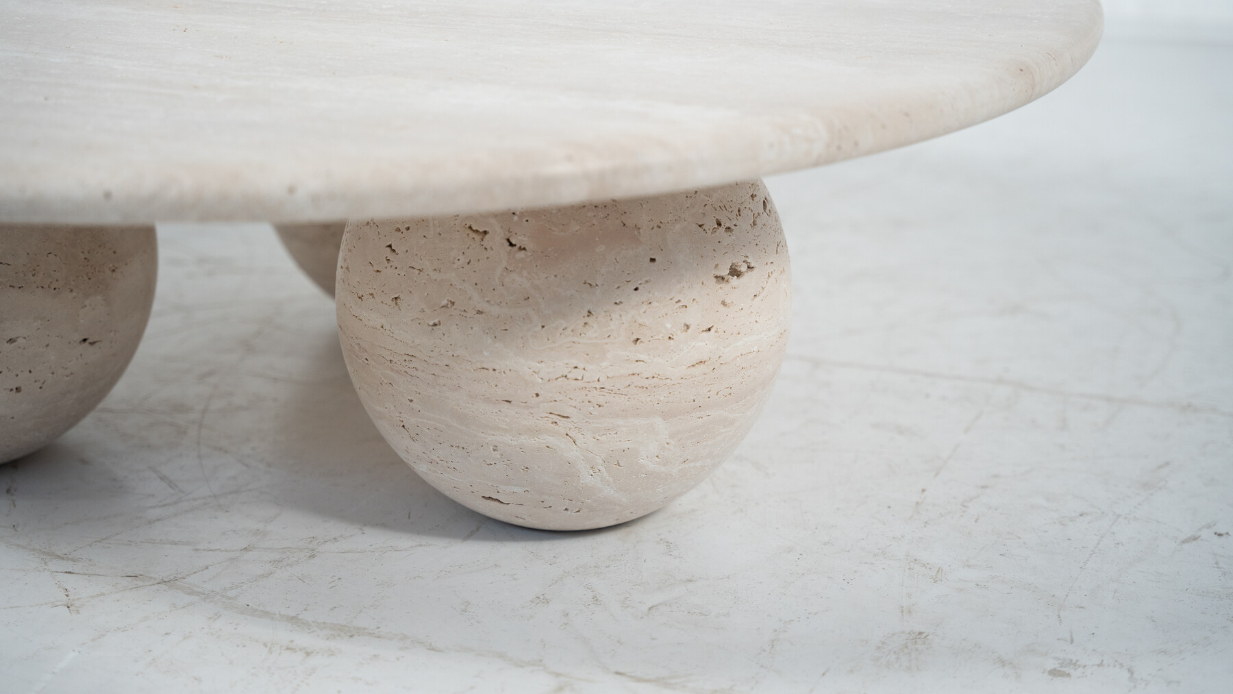 Contemporary round coffee table made of travertine, Italy