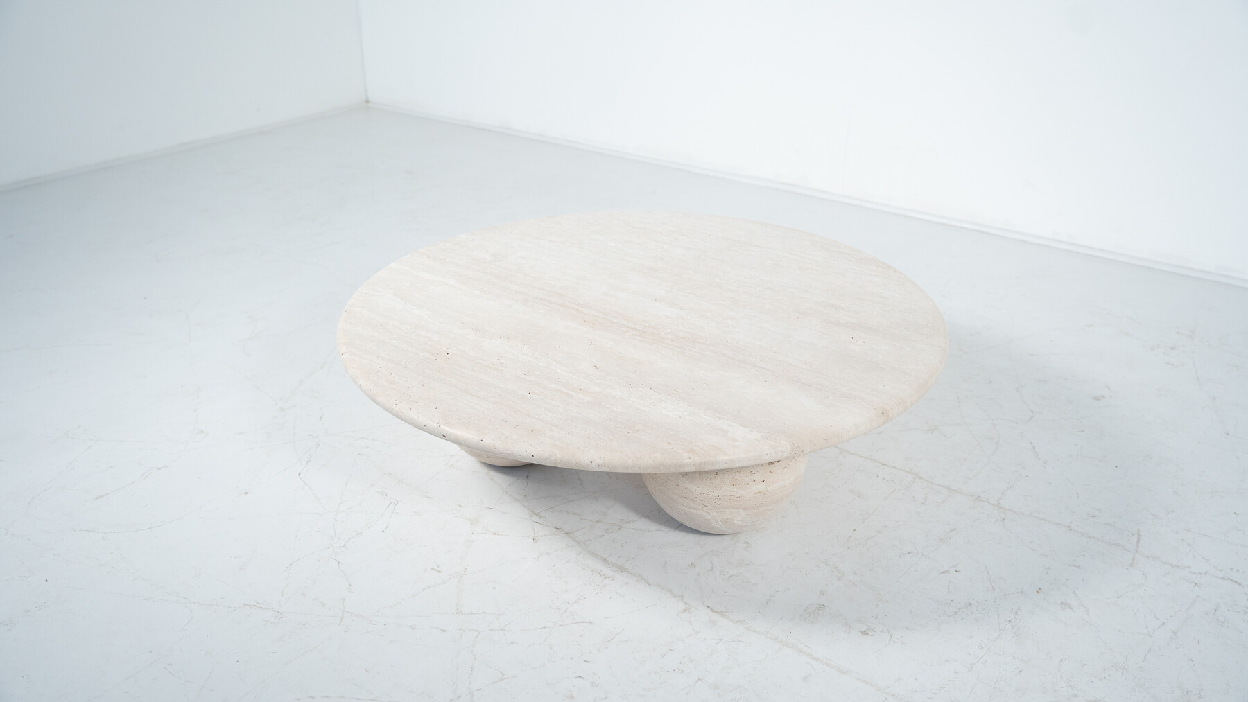 Contemporary round coffee table made of travertine, Italy