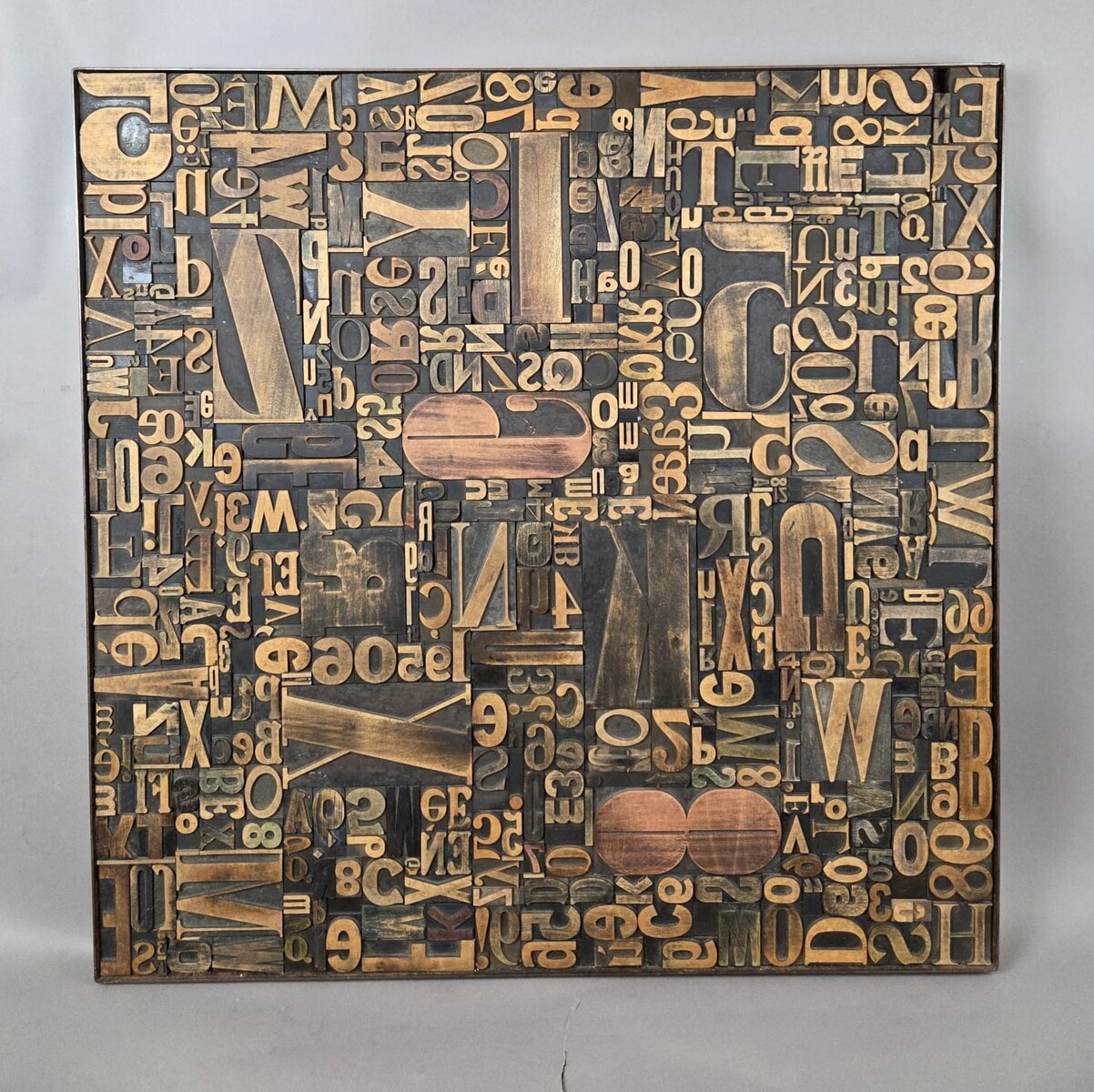 Decorative panel adorned with antique printing letters. 2 pieces available.