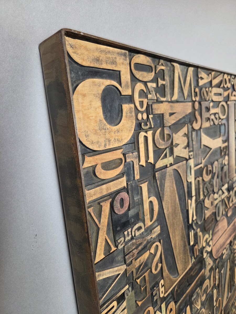 Decorative panel adorned with antique printing letters. 2 pieces available.