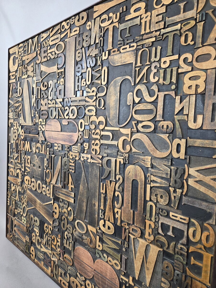 Decorative panel adorned with antique printing letters. 2 pieces available.