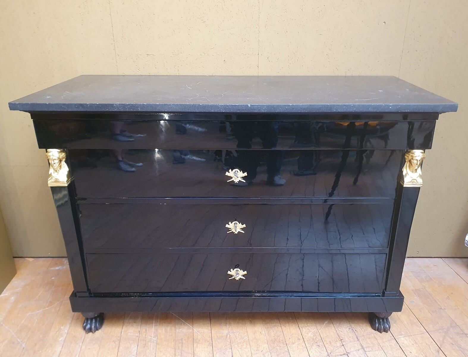 Empire chest of drawers in black lacquered wood, 19th century