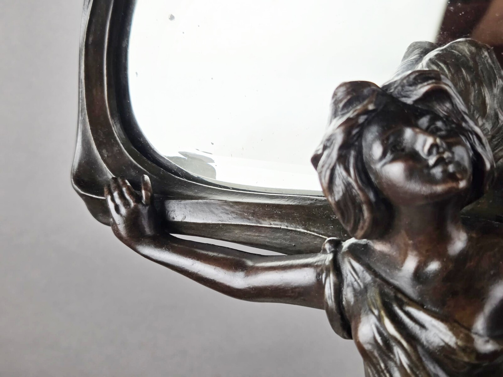 F. Flora, Art Nouveau mirror in patinated spelter