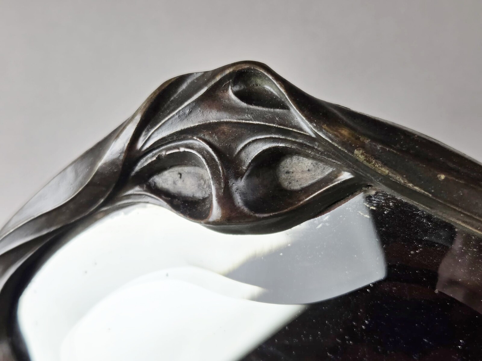 F. Flora, Art Nouveau mirror in patinated spelter