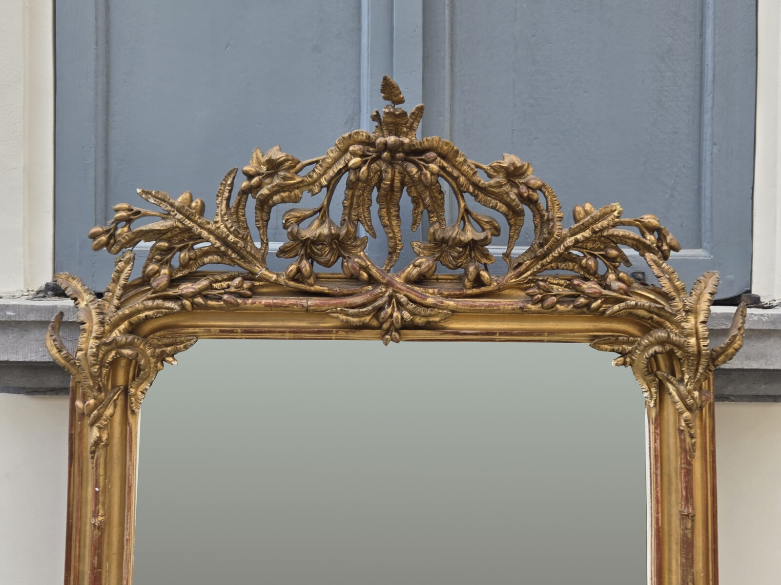 Fireplace mirror in wood and gilded stucco, 19th