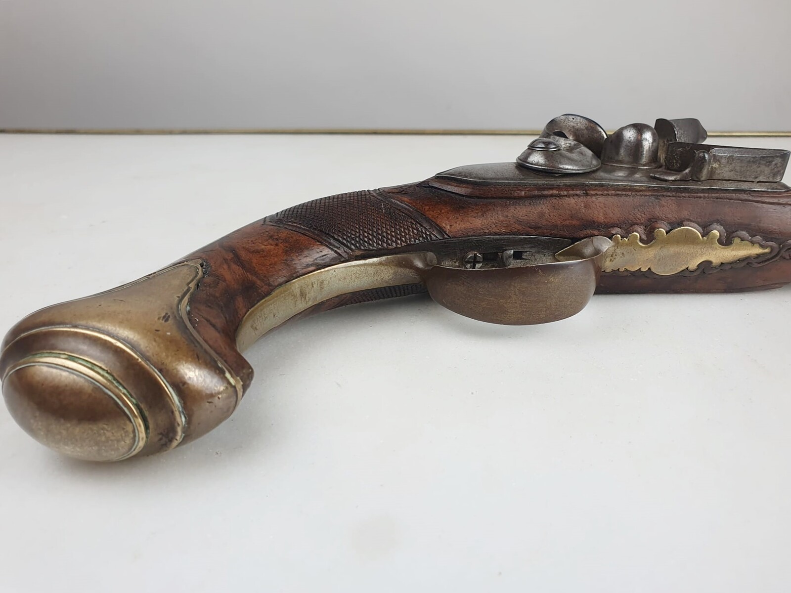 Flintlock pistol, punched and signed conon, bronze mounts, worked wooden mount, inch piece, Germany circa 1780