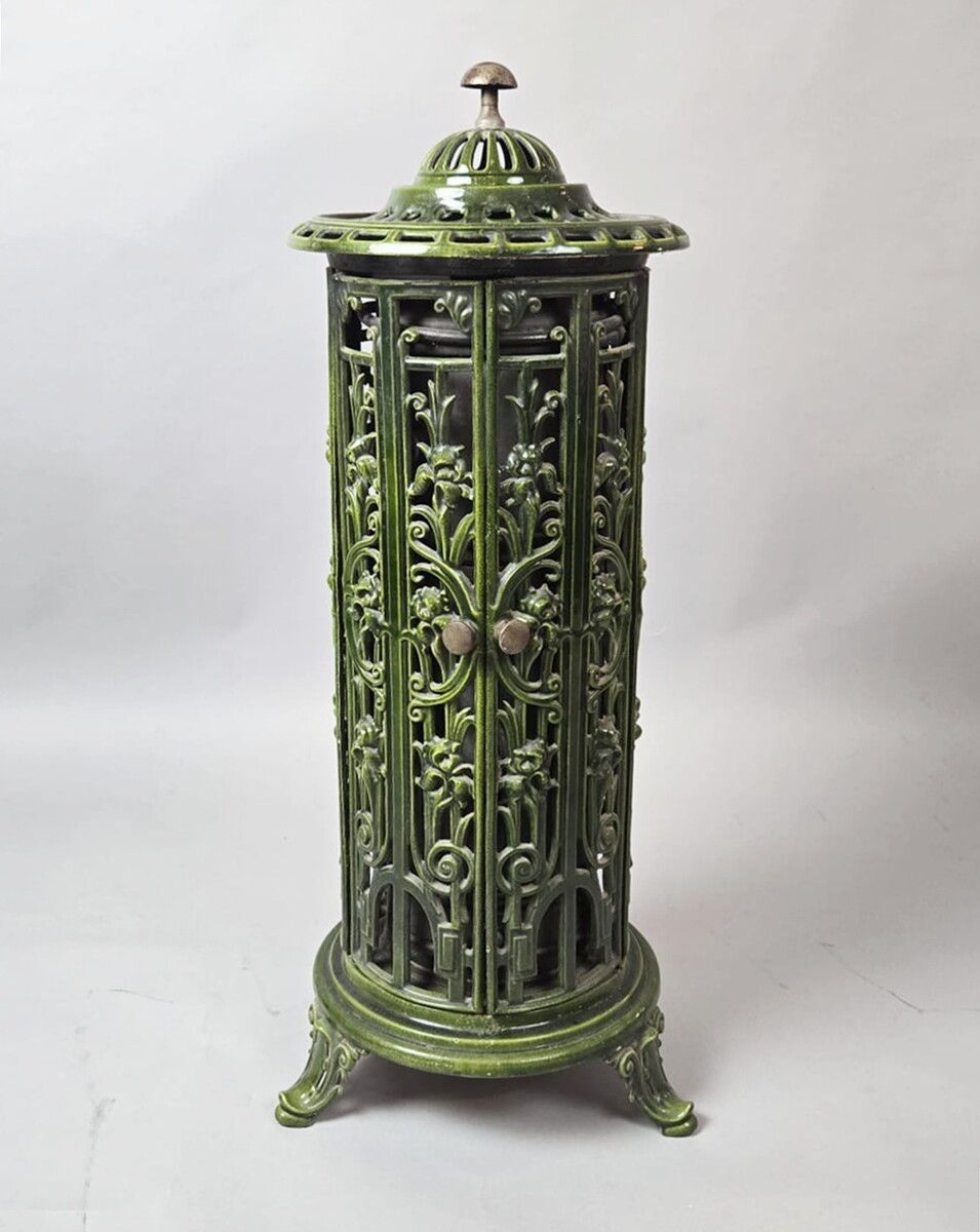 Green enameled cast iron wood-burning stove, circa 1900