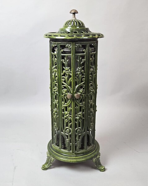 Green enameled cast iron wood-burning stove, circa 1900