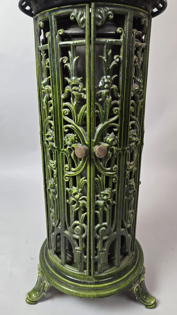 Green enameled cast iron wood-burning stove, circa 1900