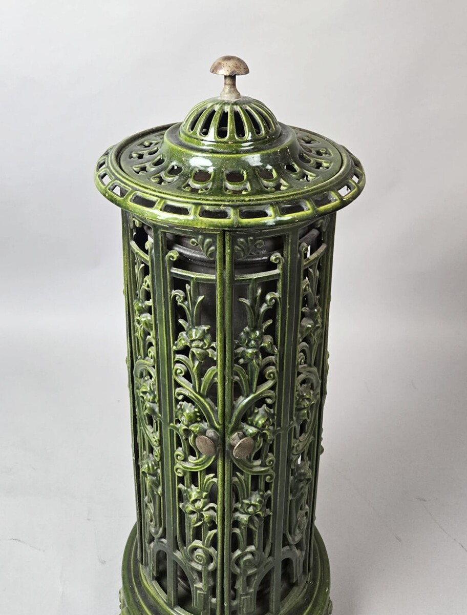 Green enameled cast iron wood-burning stove, circa 1900