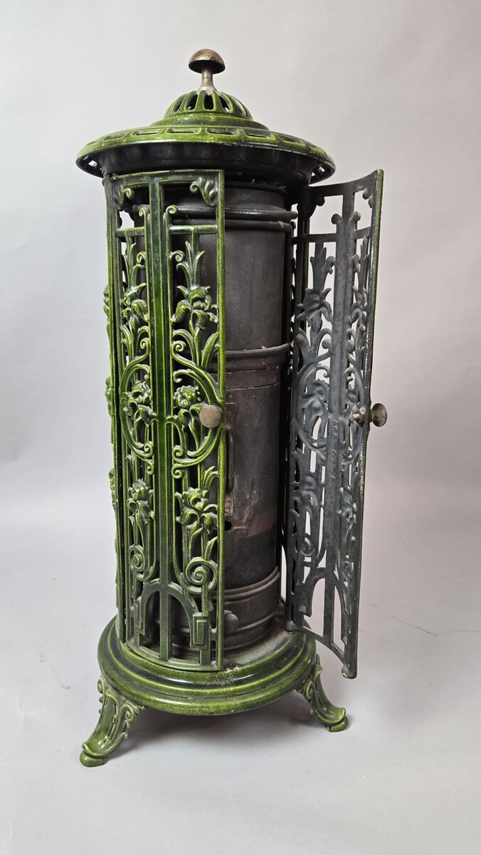 Green enameled cast iron wood-burning stove, circa 1900