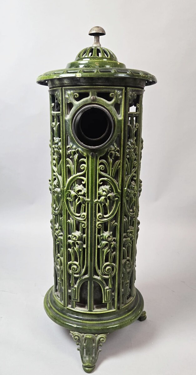 Green enameled cast iron wood-burning stove, circa 1900