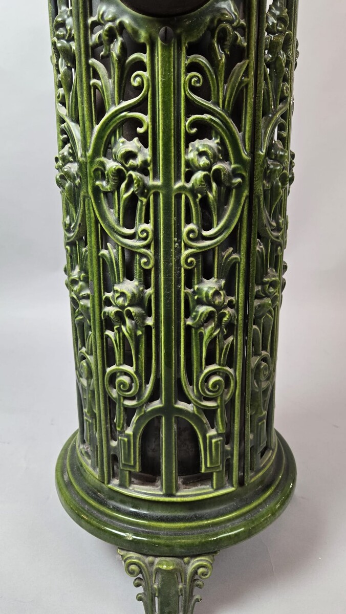 Green enameled cast iron wood-burning stove, circa 1900